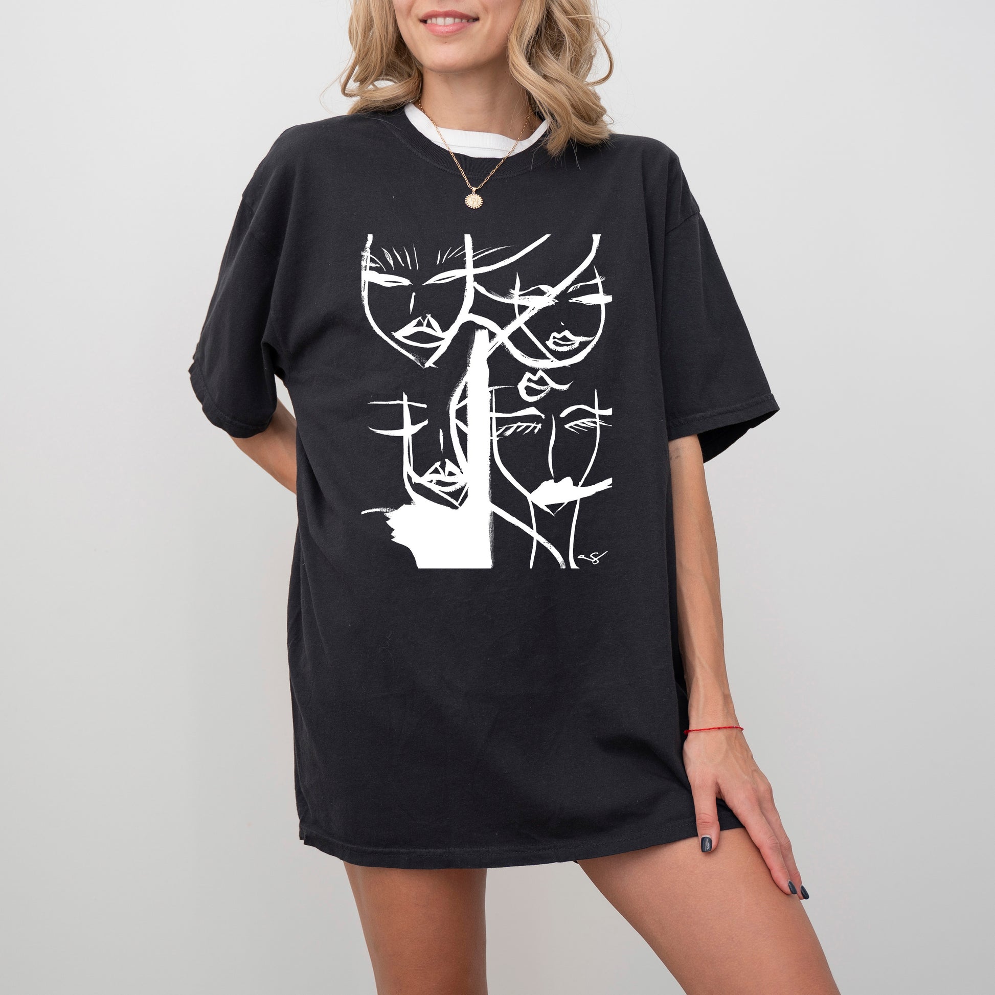 Black abstract faces T-shirt by Printify featuring artistic face designs on soft cotton fabric.
